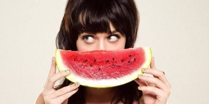 The girl on a diet with watermelon